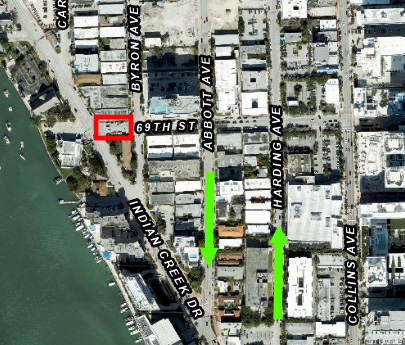 Aerial map with the closed block of 69 Street outlined in red between Indian Creek Drive and Byron Avenue, and green arrows marking the southbound detour on Abbott Avenue and the northbound detour on Harding Avenue