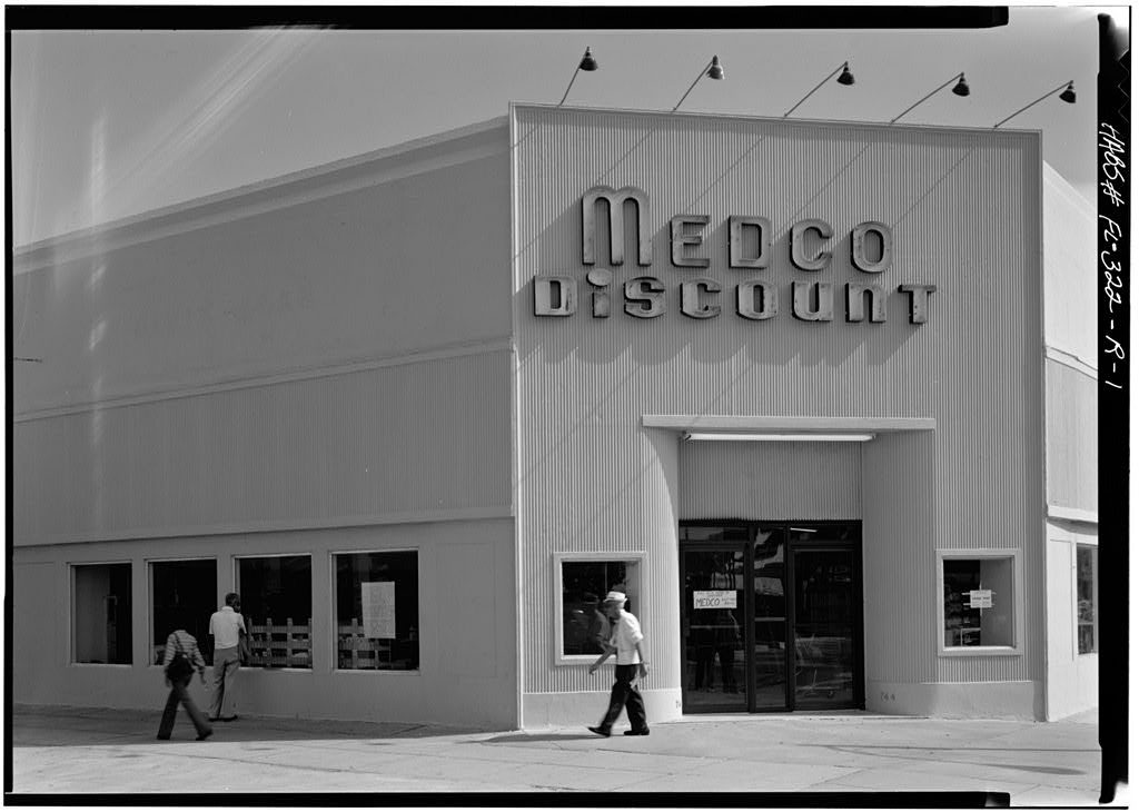A pedestrian walks past the Medco Discount storefront at 744 Lincoln Road in 1980