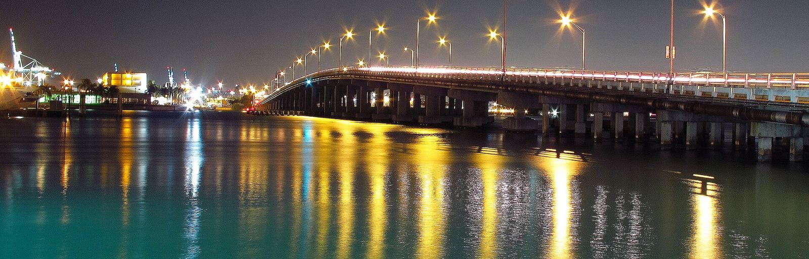 MacArthur Causeway lights reflected in Biscayne Bay at night
