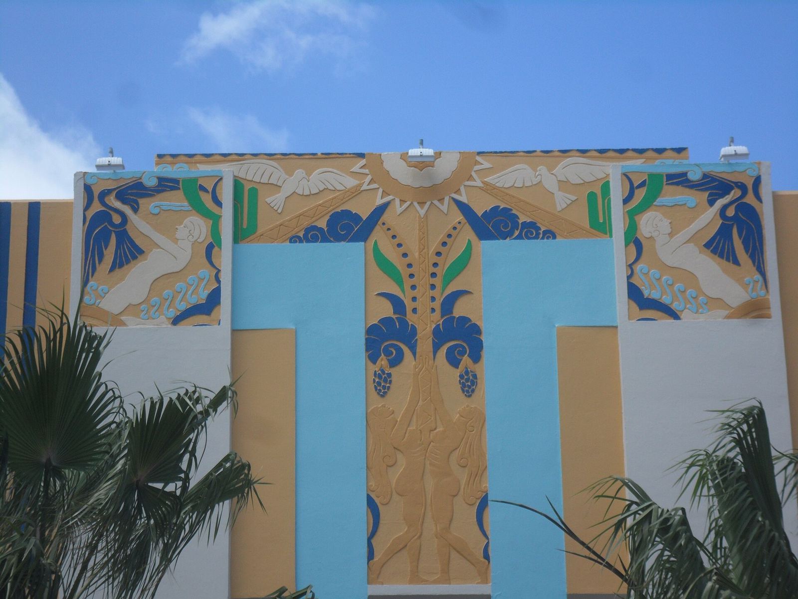 Ornate Art Deco facade in turquoise and gold