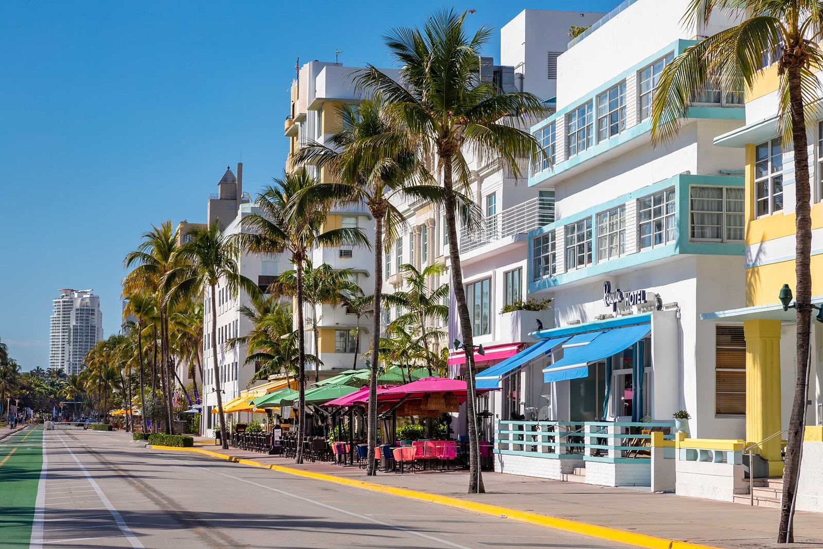 Pastel Art Deco hotels and sidewalk cafes along Ocean Drive