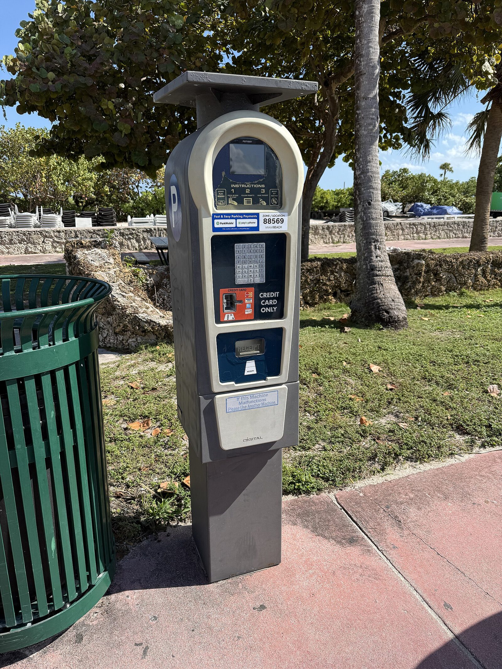 A solar-powered parking pay station at a Miami Beach park