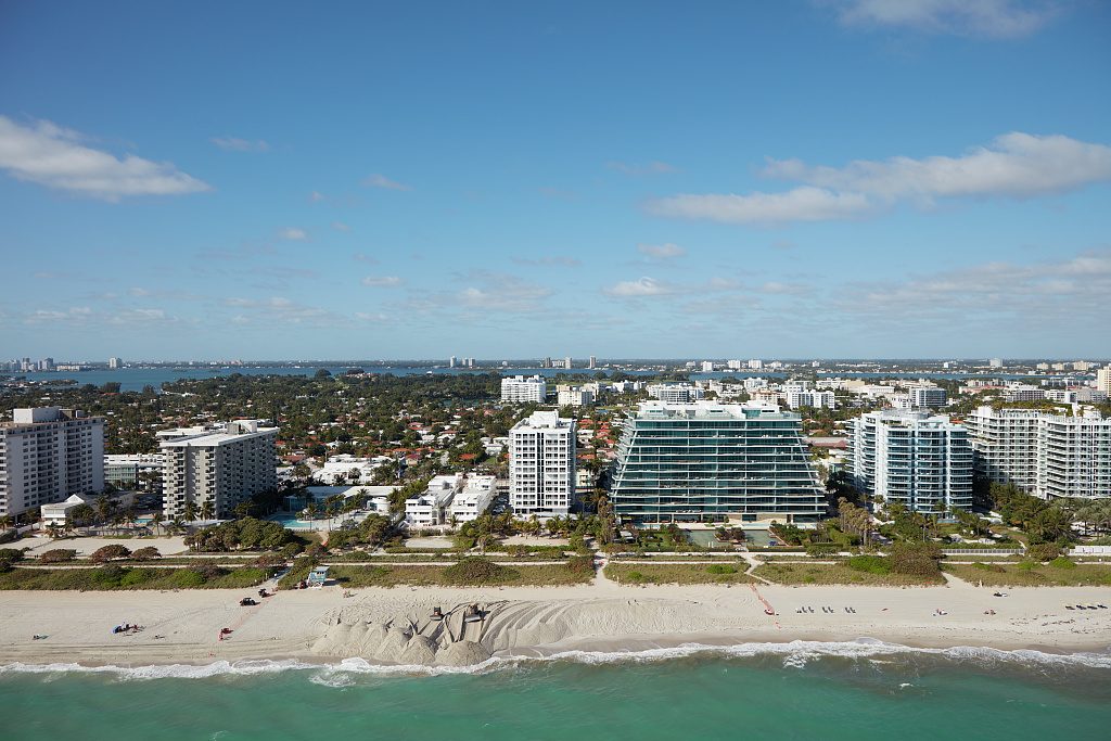 Aerial view of Surfside's oceanfront towers and low-rise neighborhood on the barrier island