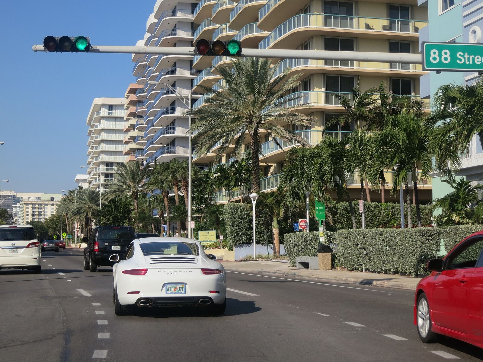 Collins Avenue traffic and condo towers at 88th Street in Surfside
